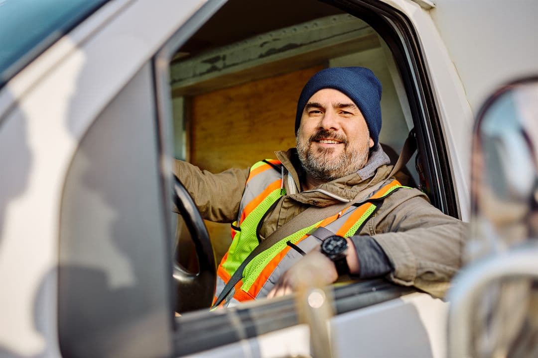A home service technician loading equipment into a work van